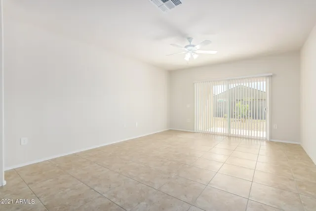 a kitchen with stainless steel appliances kitchen island granite countertop a refrigerator and a stove top oven