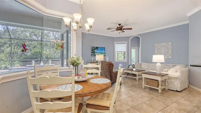 a kitchen with granite countertop a stove sink and cabinets