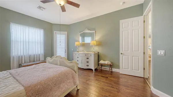 a bedroom with a bed and a dresser
