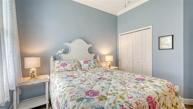 a bedroom with a bed and a table in it