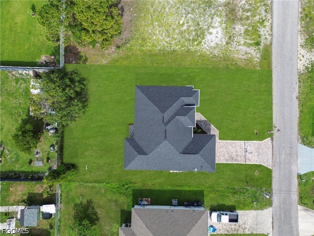3509 38th Street Southwest Lehigh Acres, FL 33976 - Photo 46 of 47 an aerial view of a house with a yard
