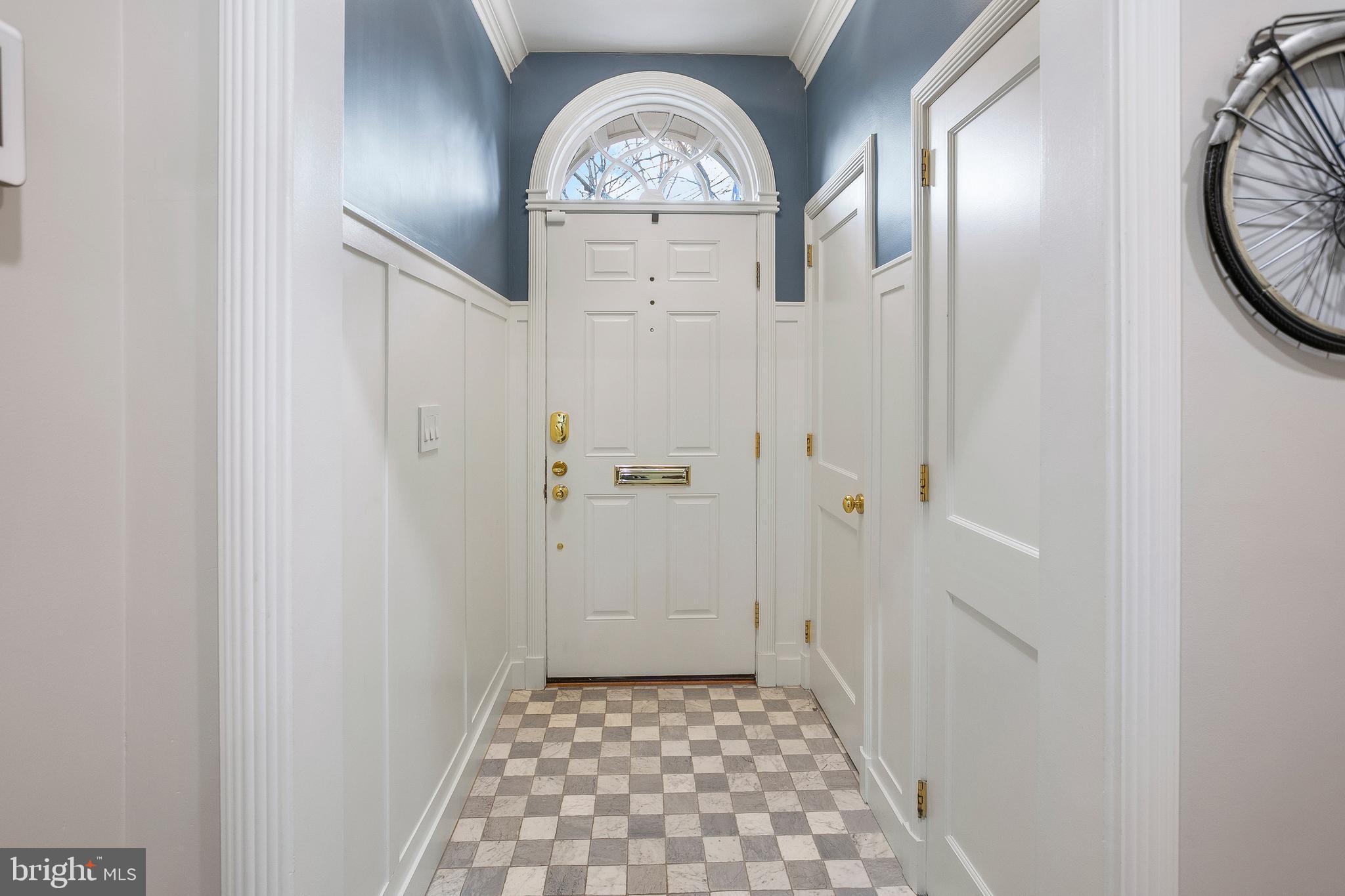 3323 Reservoir Road Northwest Washington, DC 20007 - Photo 3 of 25 Entry with Powder Room and Coat Closet