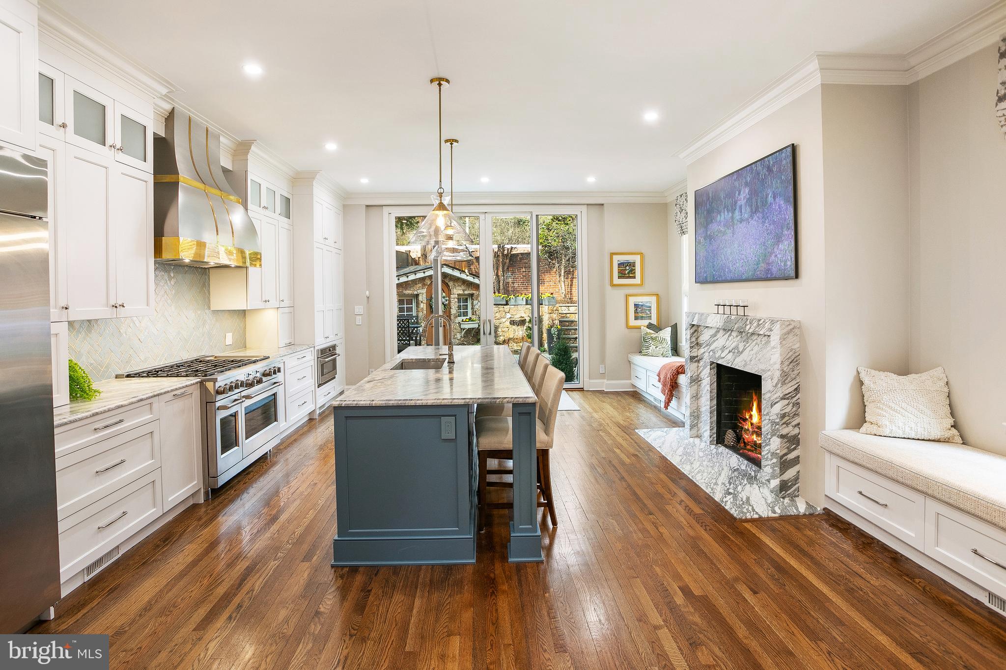 3323 Reservoir Road Northwest Washington, DC 20007 - Photo 8 of 25 Kitchen with Fireplace and Access to Terrace