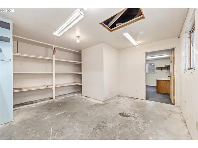 a view of a kitchen with furniture and a kitchen