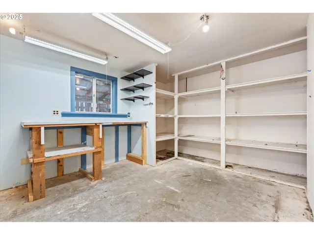 a spacious bedroom with a bed and a cabinets