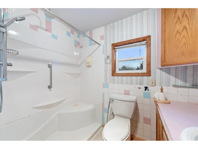 a kitchen with stainless steel appliances granite countertop a stove sink and cabinets
