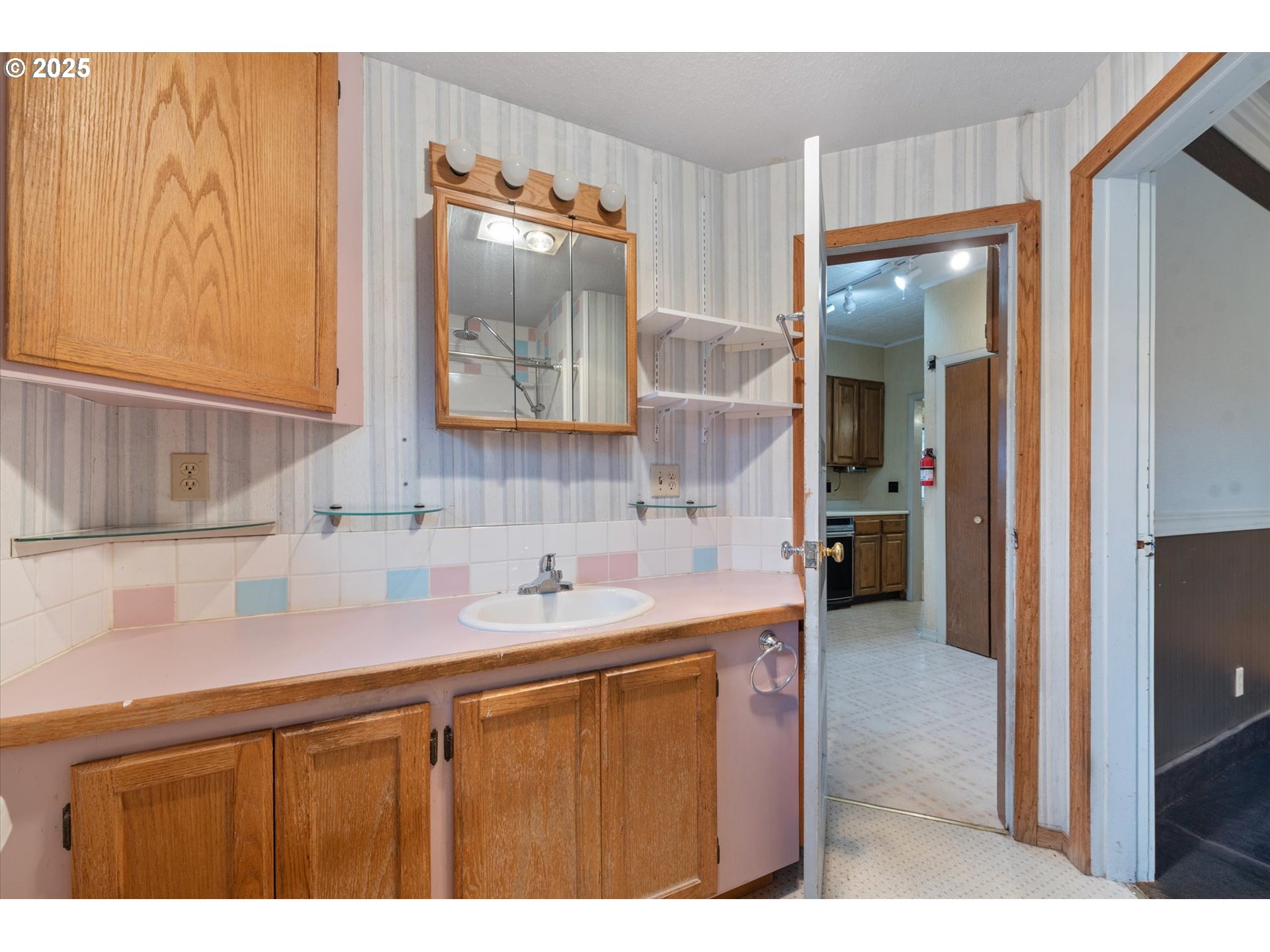 1029 Walnut Street Baker City, OR 97814 - Photo 37 of 42 a bathroom with a sink and a mirror