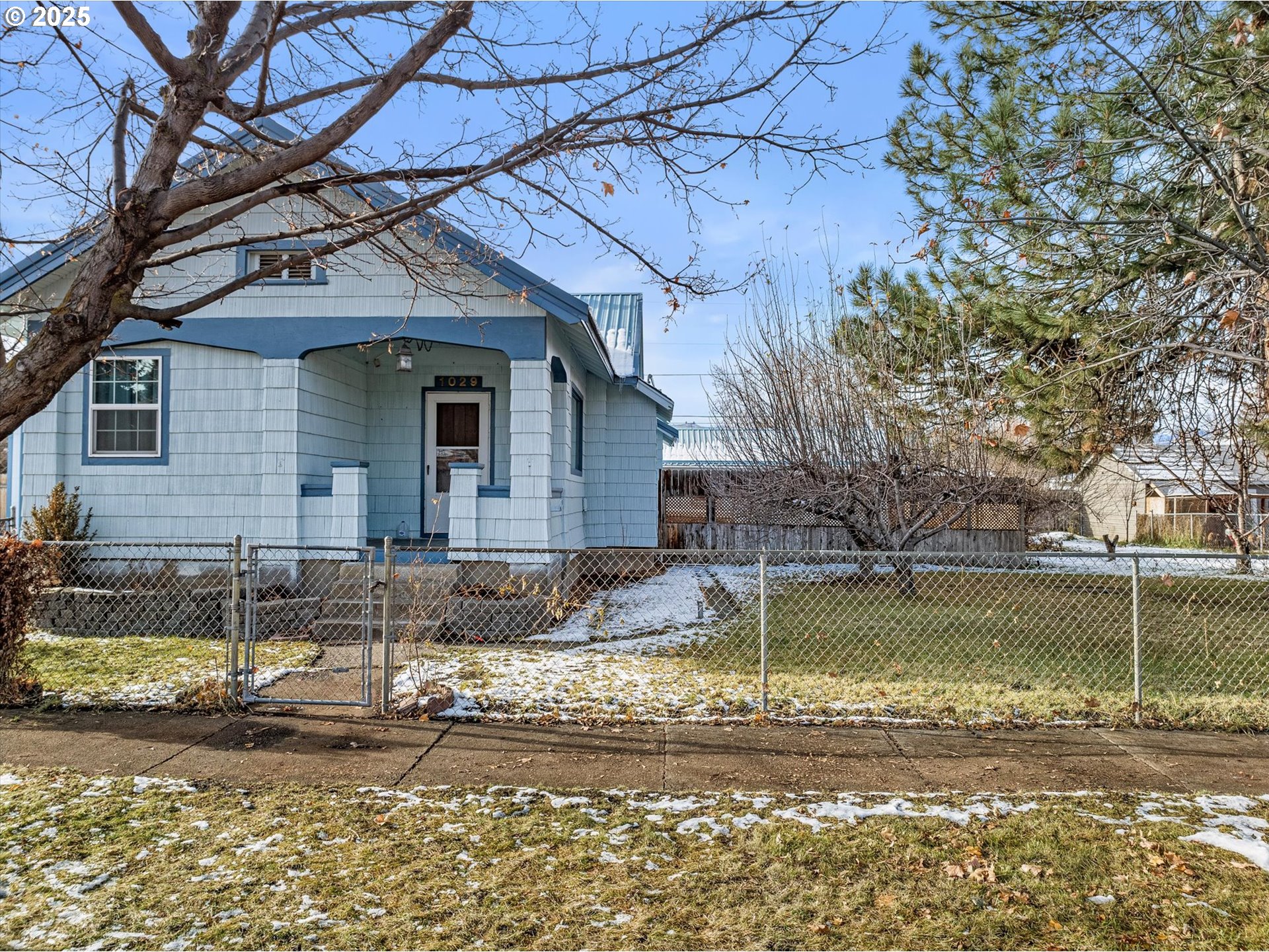1029 Walnut Street Baker City, OR 97814 - Photo 5 of 42 a view of a house with a yard