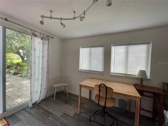 a bathroom with a sink a toilet a mirror and shower