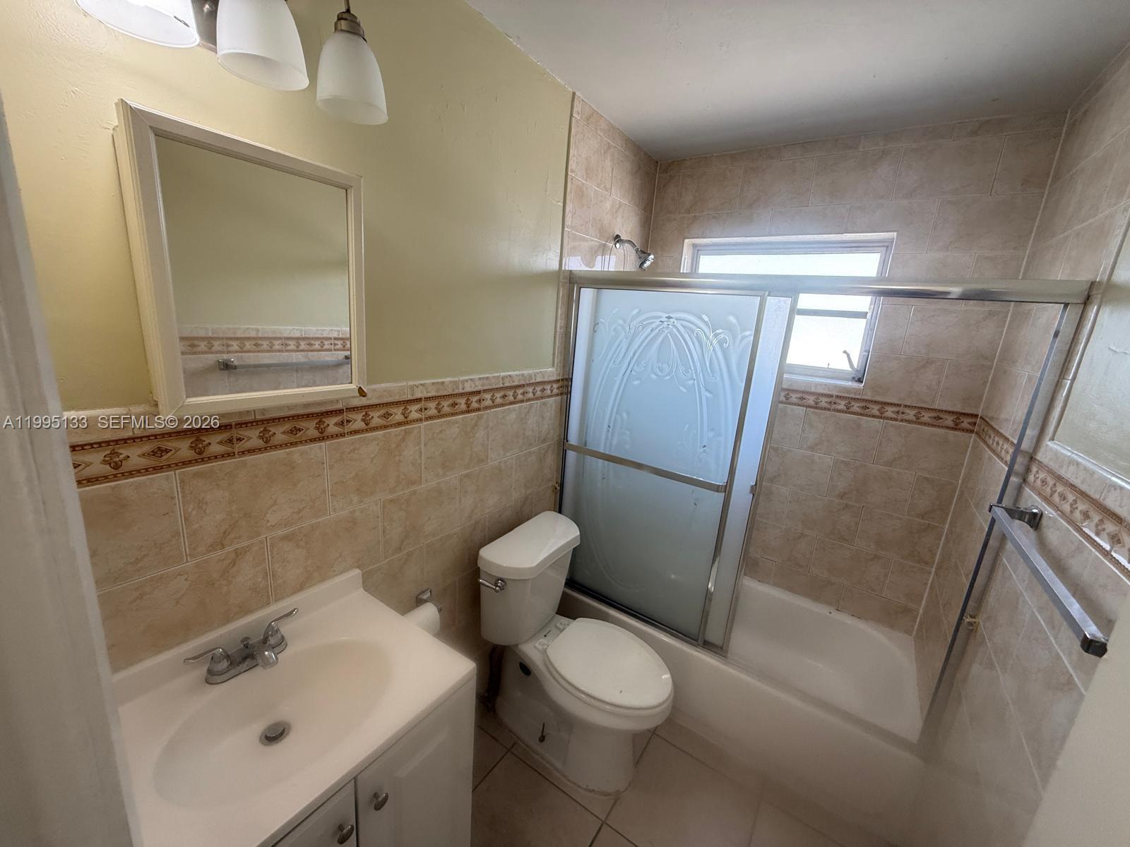 17530 Northwest 68th Avenue, Unit C4013 Hialeah, FL 33015 - Photo 3 of 4 a white toilet sitting next to a bathroom sink