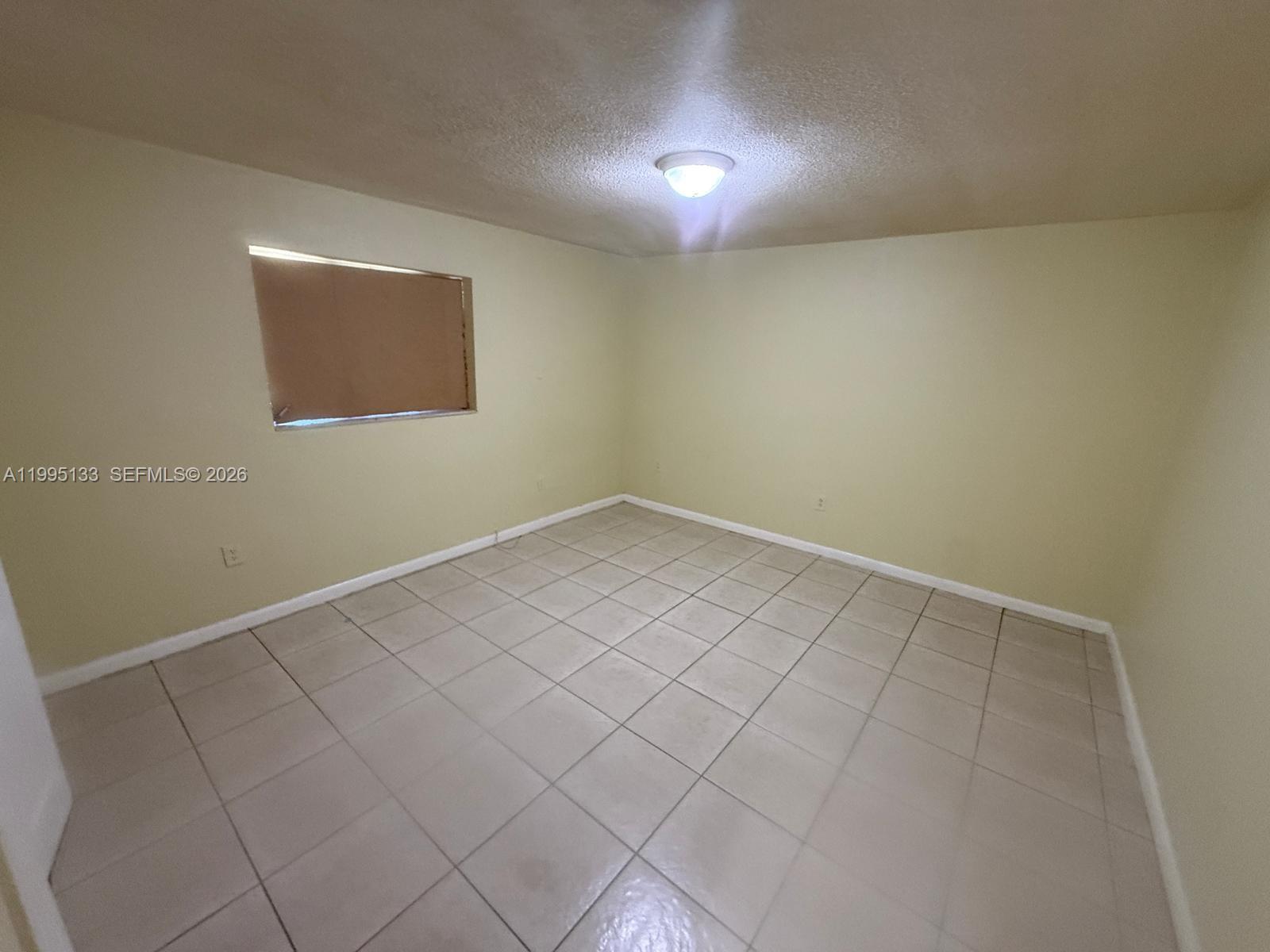 17530 Northwest 68th Avenue, Unit C4013 Hialeah, FL 33015 - Photo 4 of 4 a view of an empty room