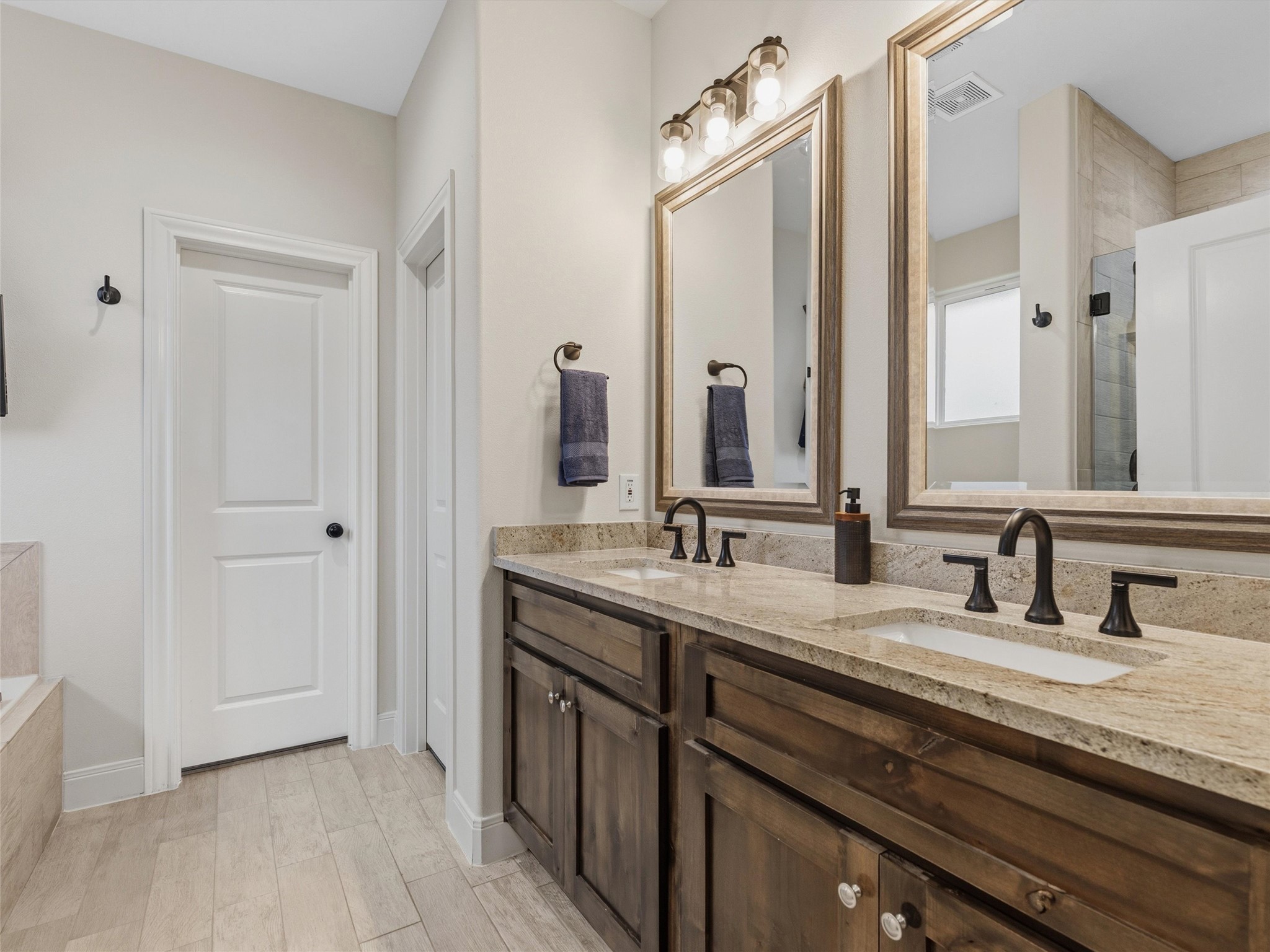 334 Webb Street Smithville, TX 78957 - Photo 16 of 36 a bathroom with a double vanity sink and a mirror