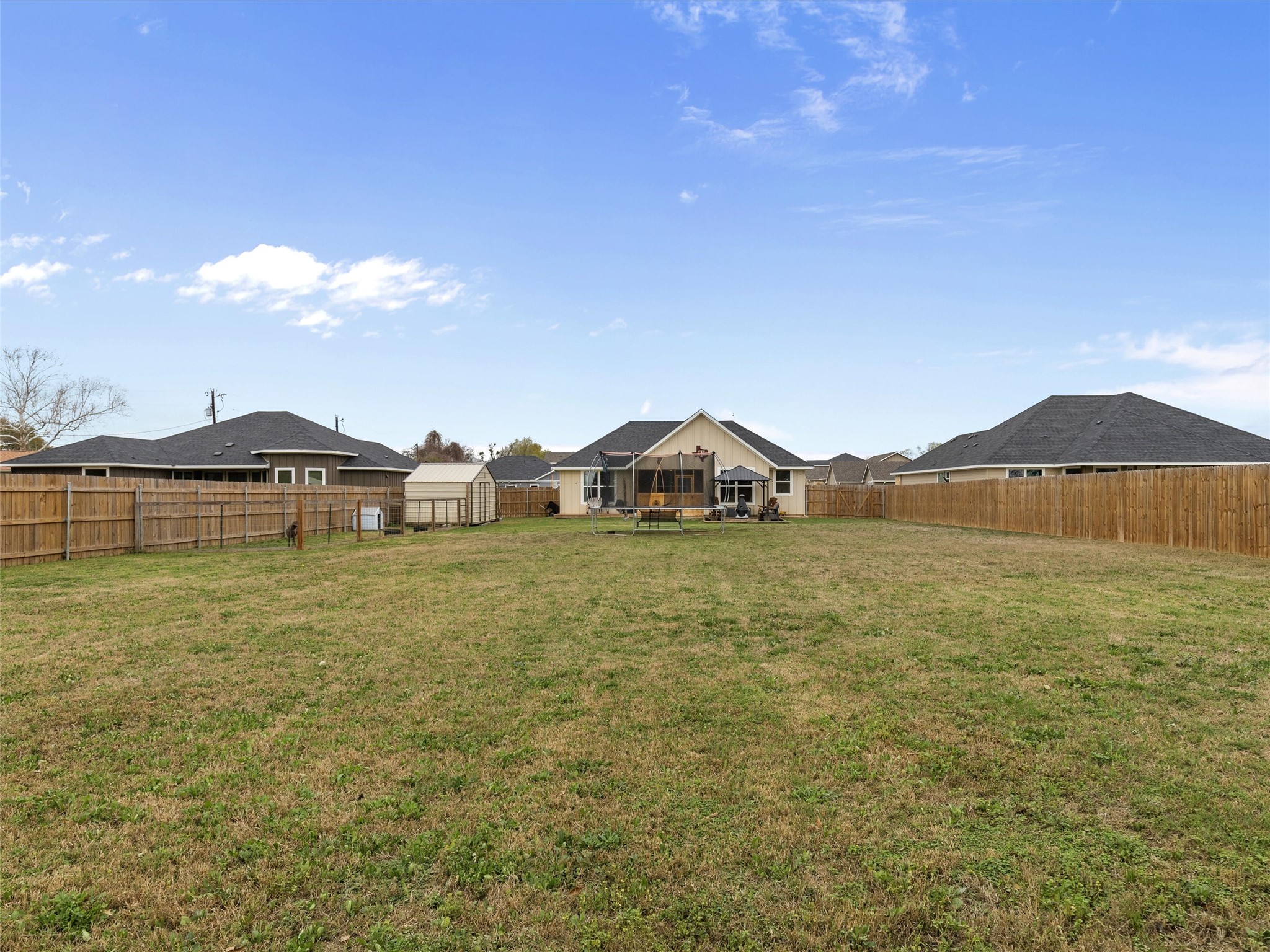 334 Webb Street Smithville, TX 78957 - Photo 33 of 36 a view of a house with a yard and a large tree