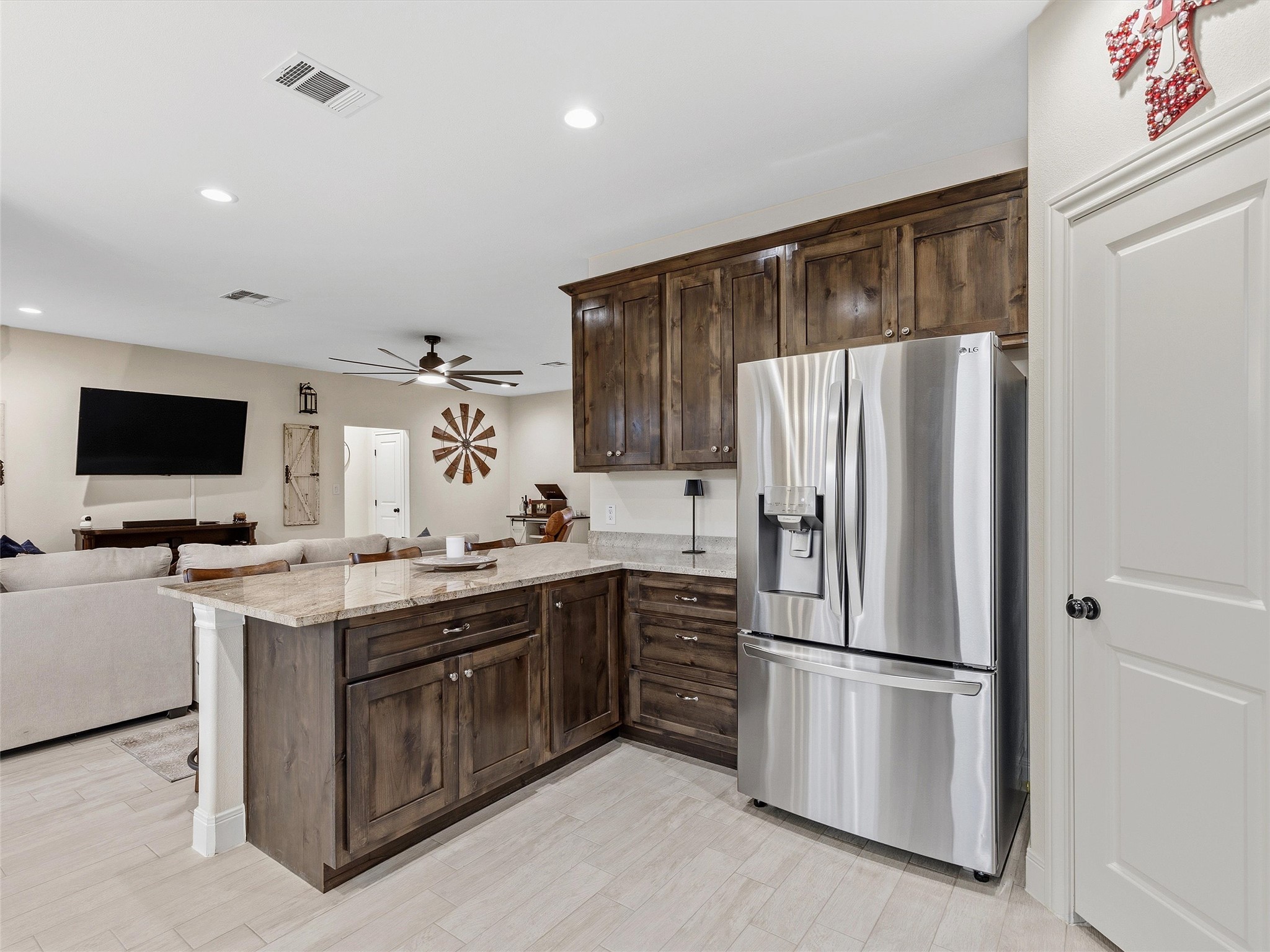 334 Webb Street Smithville, TX 78957 - Photo 7 of 36 a kitchen with stainless steel appliances a refrigerator and a stove top oven