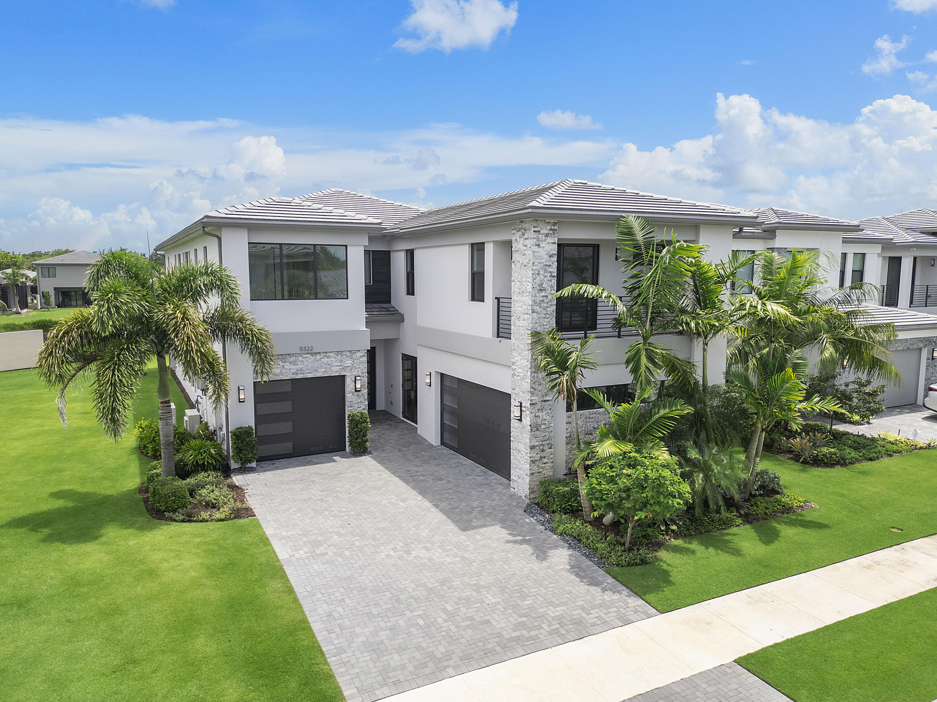 9322 Sunflower Mdw Road Boca Raton, FL 33434 - Photo 1 of 87 a front view of a house with a garden