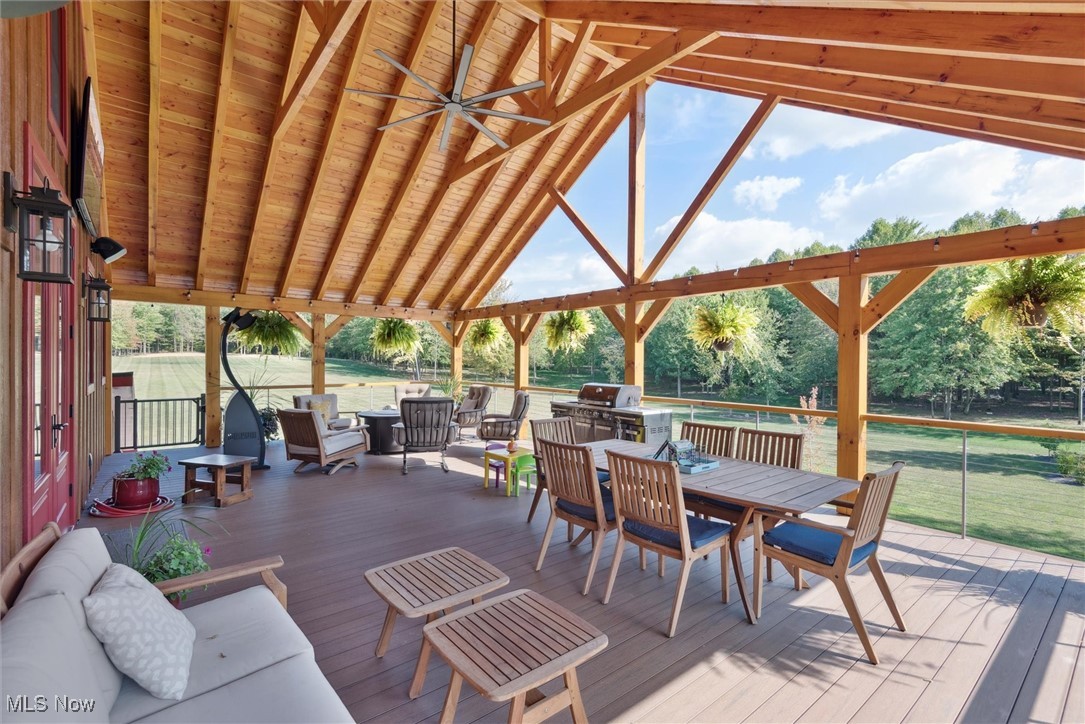290 Townline Road Aurora, OH 44202 - Photo 27 of 50 Deck featuring outdoor dining area, grilling area, and ceiling fan