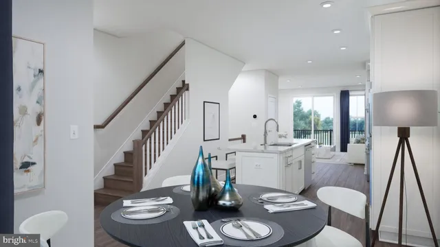 a very nice looking dining room with furniture a rug and wooden floor