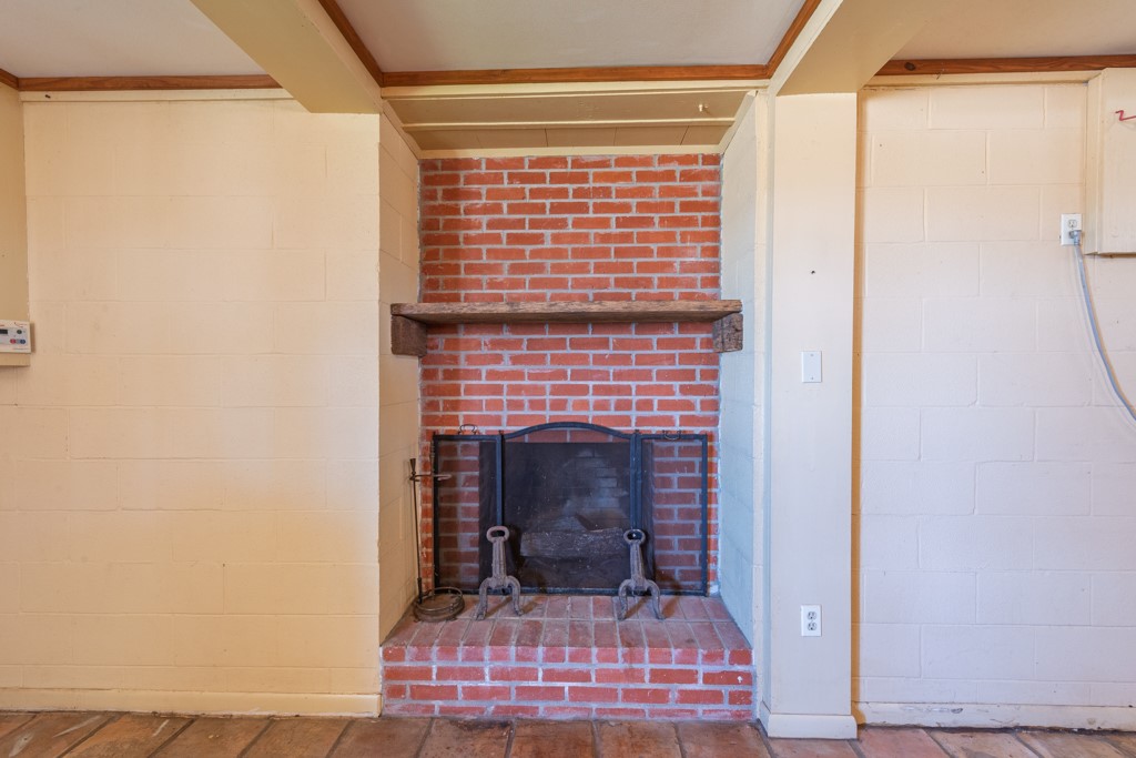 167 Buckeye Knoll Road George West, TX 78022 - Photo 22 of 40 a view of hall way with furniture and a fireplace