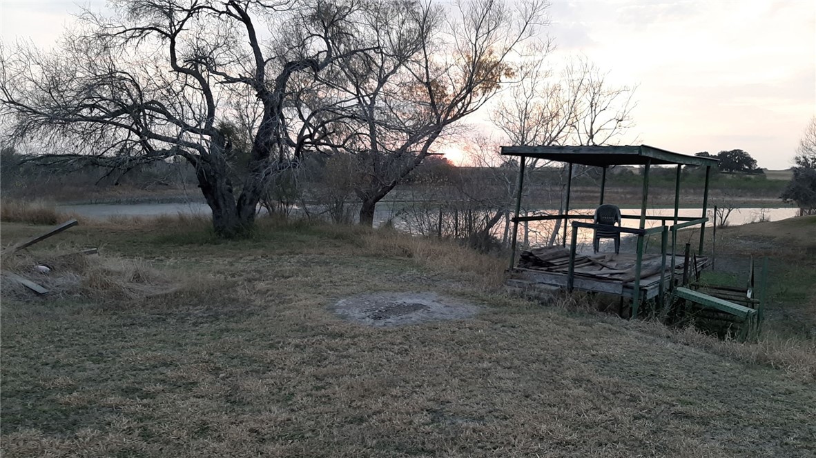 167 Buckeye Knoll Road George West, TX 78022 - Photo 24 of 40 a view of a backyard with a sitting area