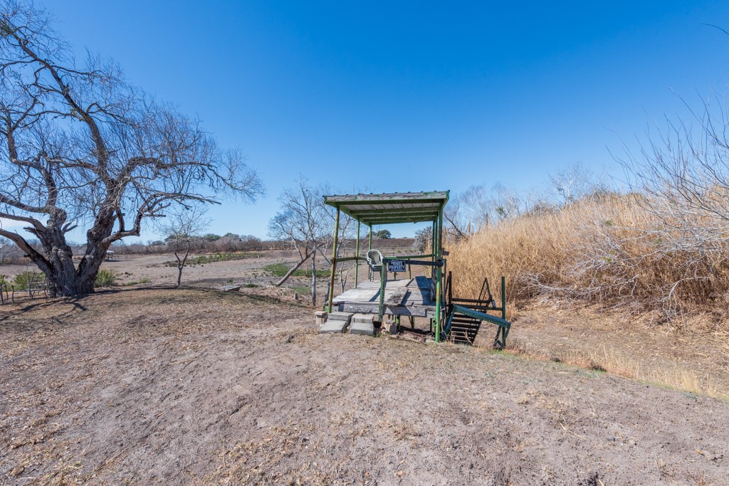 167 Buckeye Knoll Road George West, TX 78022 - Photo 25 of 40 a view of a bench in a backyard