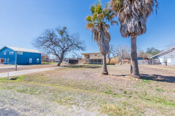 a view of mountain with sunset in background