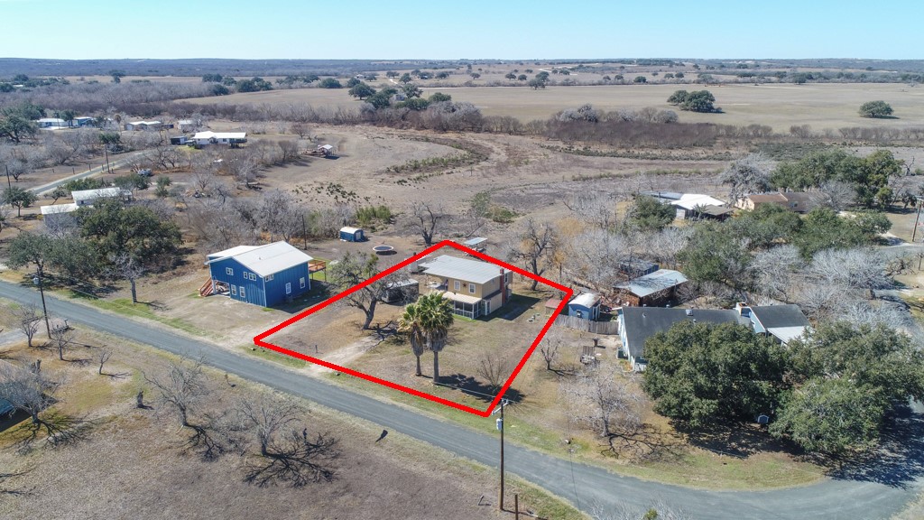 167 Buckeye Knoll Road George West, TX 78022 - Photo 32 of 40 an aerial view of a house