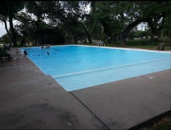 167 Buckeye Knoll Road George West, TX 78022 - Photo 39 of 40 a view of swimming pool with an outdoor space and seating area