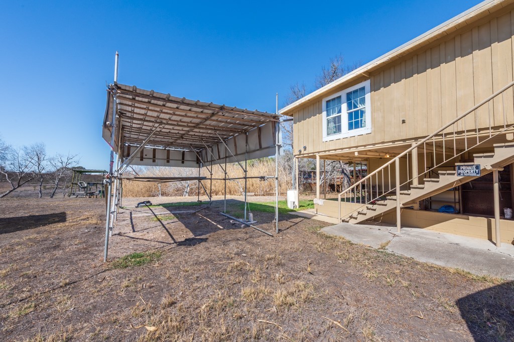 167 Buckeye Knoll Road George West, TX 78022 - Photo 6 of 40 a view of a house with backyard and sitting area