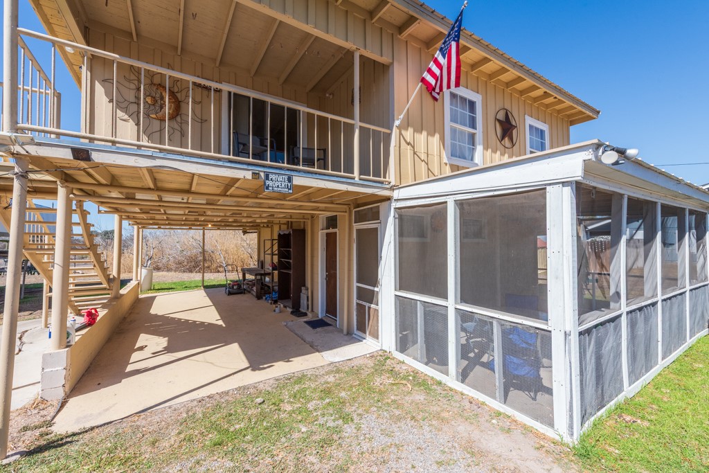 167 Buckeye Knoll Road George West, TX 78022 - Photo 7 of 40 a view of a large building with a large window