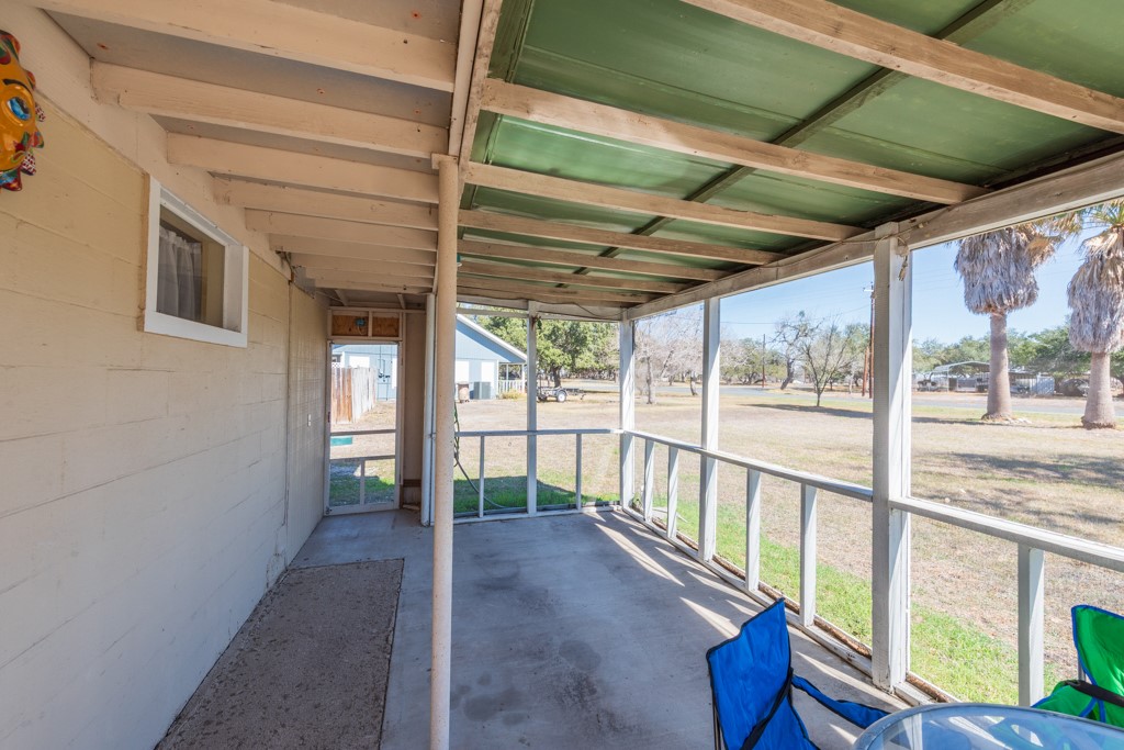 167 Buckeye Knoll Road George West, TX 78022 - Photo 8 of 40 a view of porch with a furniture
