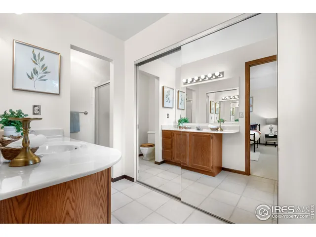 a kitchen with a sink refrigerator and cabinets