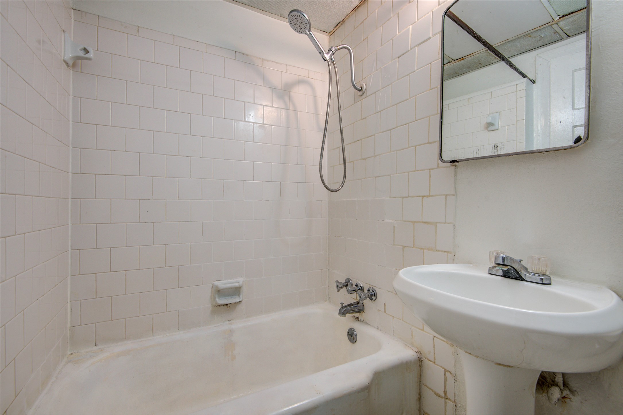 1828 West Main Street, Unit 1 Houston, TX 77098 - Photo 16 of 20 a bathroom with a sink a toilet and shower