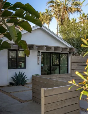 a view of living room kitchen with furniture