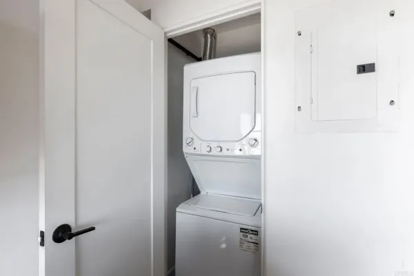 a wooden bench sitting in front of a building