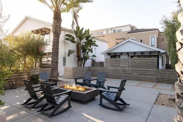 a view of a backyard with sitting area and furniture