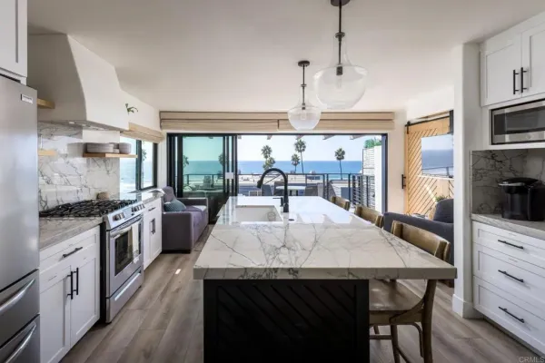a kitchen with a table chairs stove and cabinets