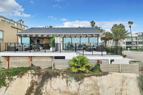 a front view of house with yard and trees