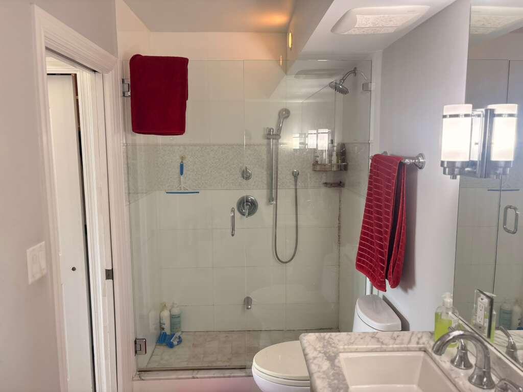 2611 North Riverside Drive, Unit 703 Pompano Beach, FL 33062 - Photo 63 of 81 a bathroom with a sink and shower