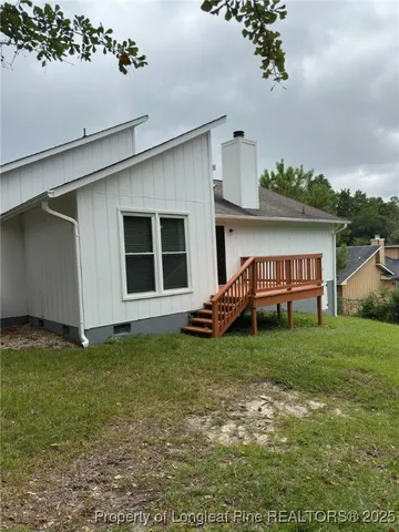 a view of a backyard with plants and a garden