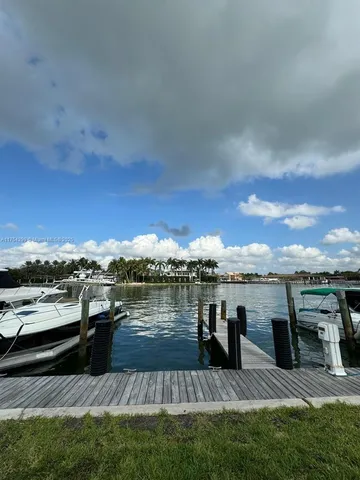 a view of a terrace with outdoor seating and water view