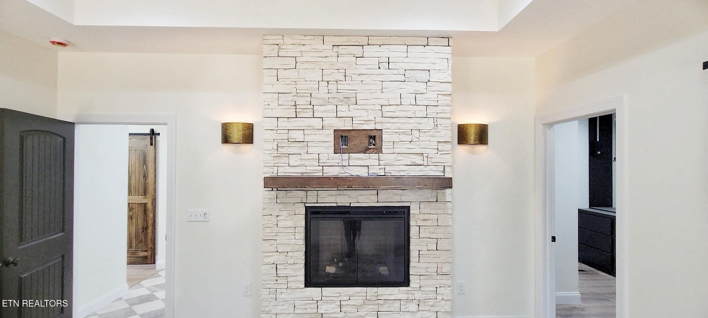 236 Meadowood Road Newport, TN 37821 - Photo 26 of 42 MAIN SUITE STACKED STONE FIREPLACE