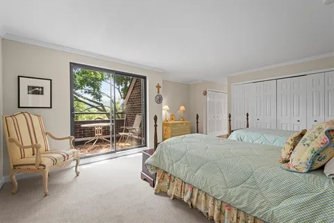 a bedroom with a bed and lamp