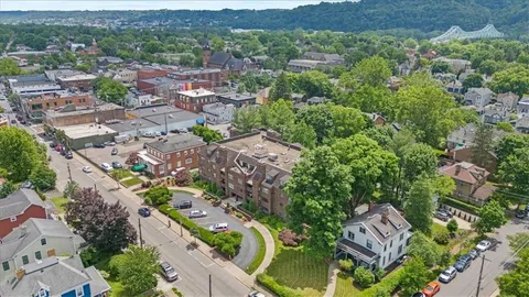 an aerial view of a house with a yard
