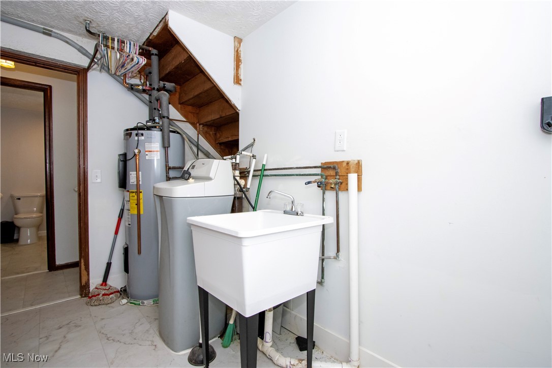 2781 North Firestone Road Wooster, OH 44691 - Photo 10 of 41 Laundry area with sink and water heater