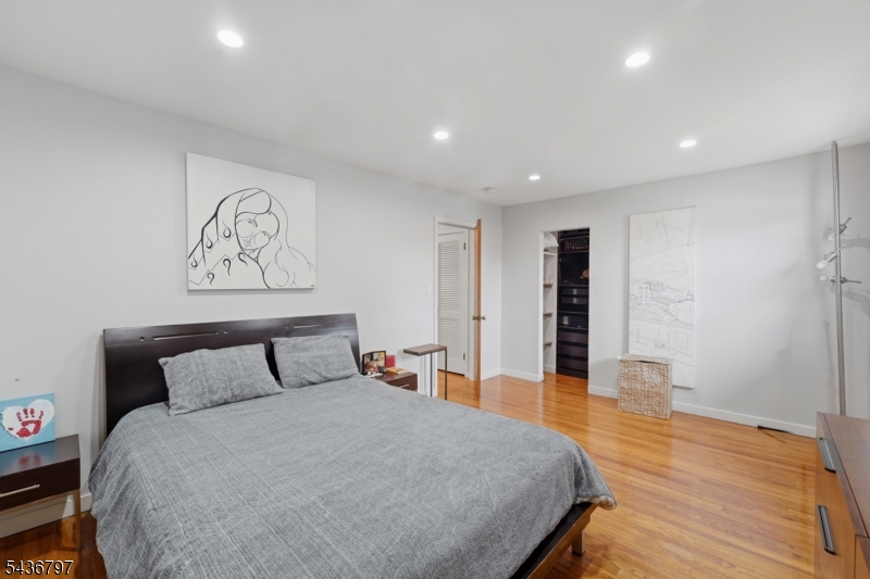 17 Arthur Drive Rutherford, NJ 07070 - Photo 23 of 45 a spacious bedroom with a bed and wooden floor