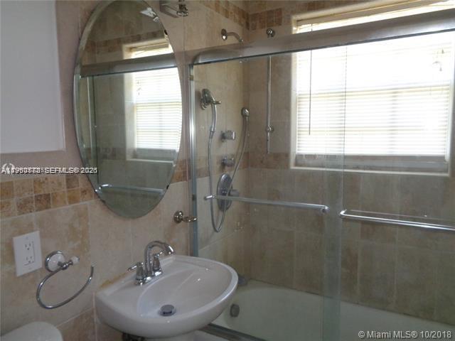 1925 Thomas Street, Unit 1925 Hollywood, FL 33020 - Photo 12 of 24 a bathroom with a sink toilet and shower