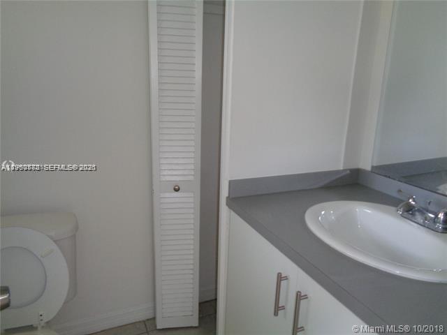 1925 Thomas Street, Unit 1925 Hollywood, FL 33020 - Photo 15 of 24 a bathroom with a sink and a toilet