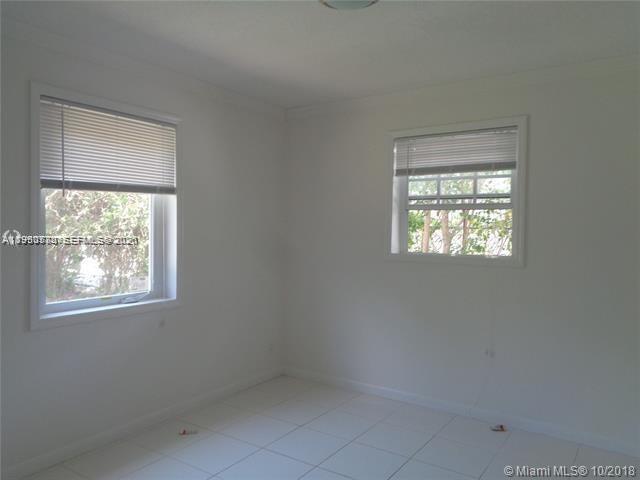 1925 Thomas Street, Unit 1925 Hollywood, FL 33020 - Photo 18 of 24 an empty room with a window