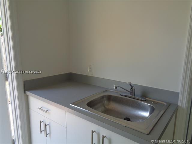 1925 Thomas Street, Unit 1925 Hollywood, FL 33020 - Photo 7 of 24 a close view of sink and tap