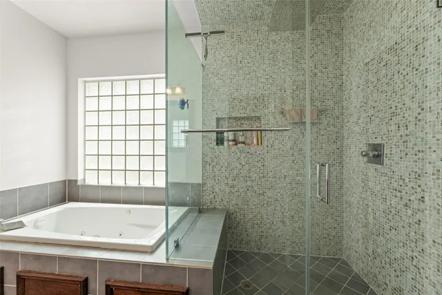 a living room with furniture ceiling fan and a window